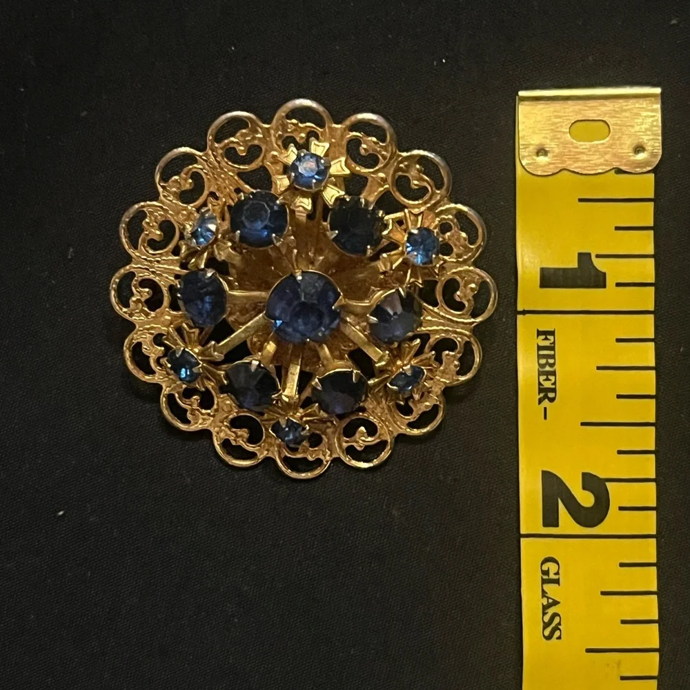 Vintage Gold Tone Circle Brooch with Deep Blue Rhinestones